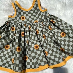 Toddler 2T Fall theme checkered dress with Sunflower detail.